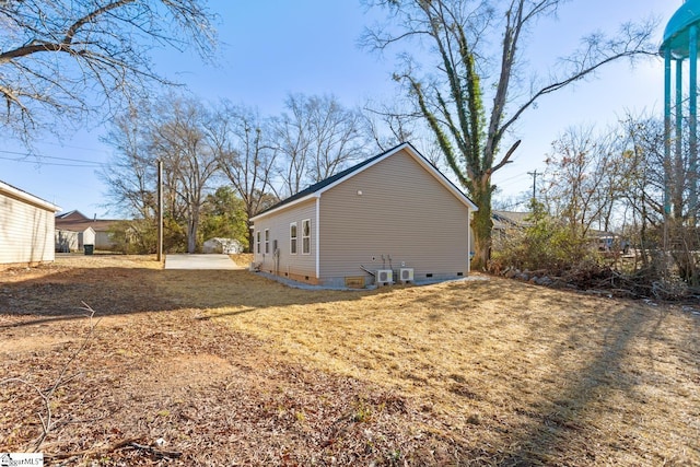 view of side of property with a yard