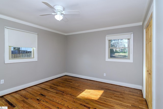 spare room featuring ceiling fan, crown molding, and hardwood / wood-style floors