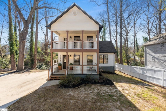 view of front facade with a porch and a balcony