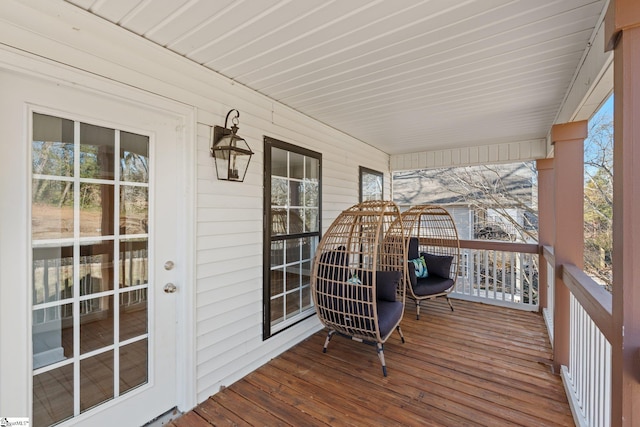 wooden terrace with a porch