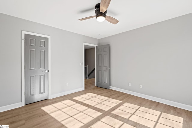 unfurnished bedroom featuring ceiling fan and light hardwood / wood-style floors