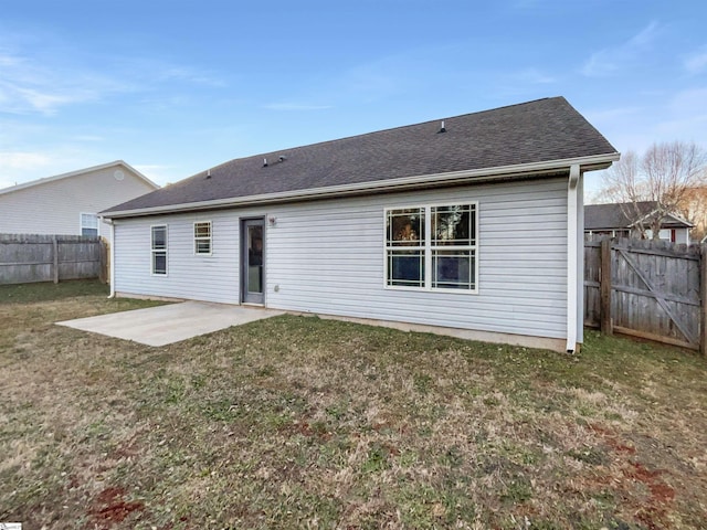 back of property featuring a lawn and a patio area