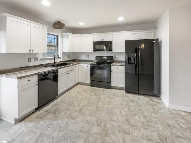 kitchen with white cabinets, black appliances, and sink