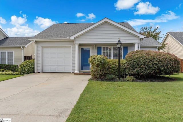 view of front of property featuring a front lawn and a garage