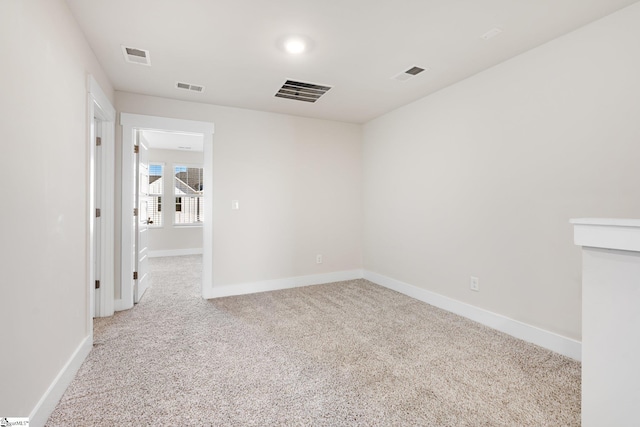 unfurnished room with light carpet