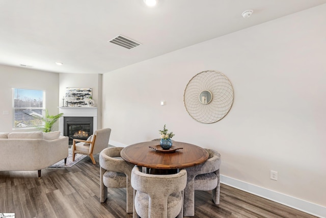 dining space featuring wood-type flooring