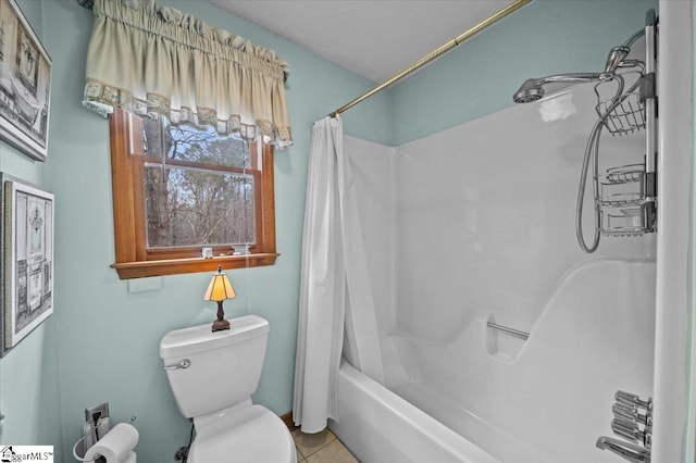 bathroom featuring toilet, shower / bathtub combination with curtain, and tile patterned floors