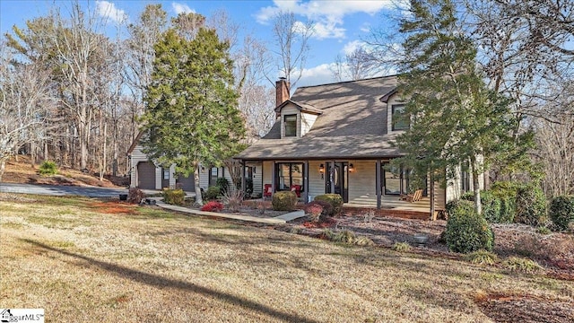 cape cod house featuring a porch and a front lawn