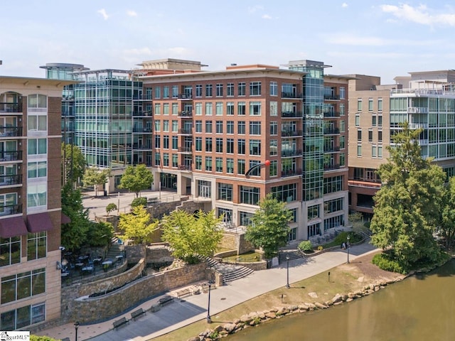 view of building exterior with a water view