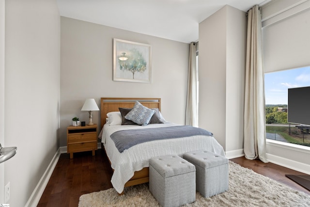 bedroom featuring dark wood-type flooring