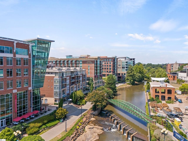 birds eye view of property with a water view