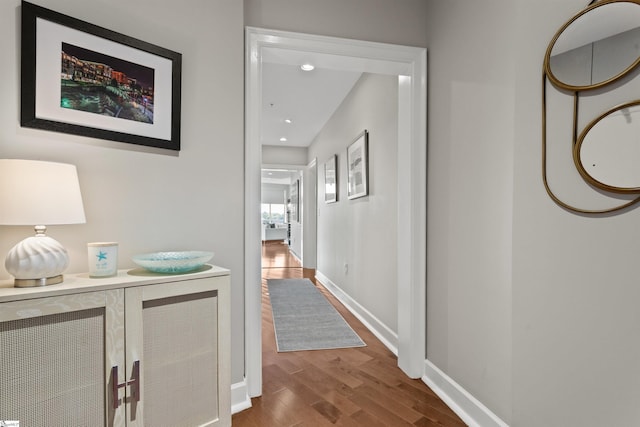 hallway with wood-type flooring