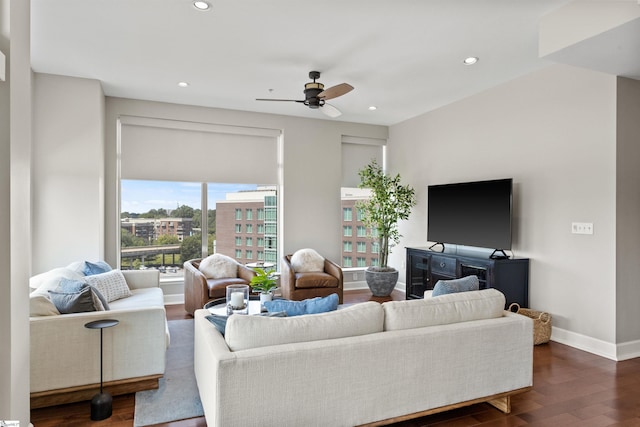 living room with ceiling fan and dark hardwood / wood-style floors