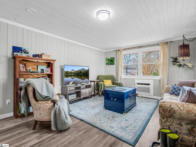 living room with wood ceiling, ornamental molding, and wood-type flooring