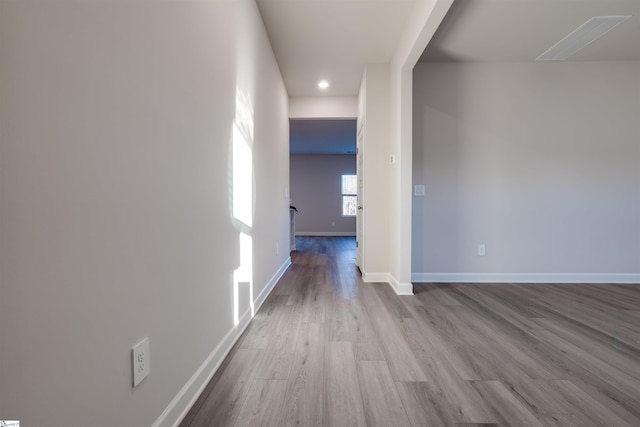 hall with light hardwood / wood-style floors