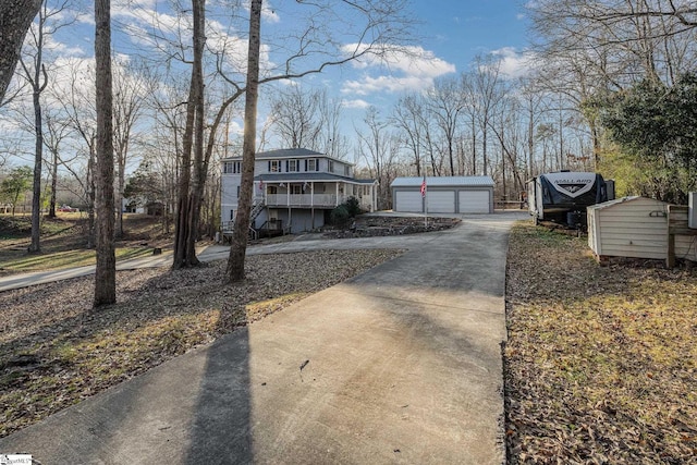 exterior space with a garage and an outdoor structure