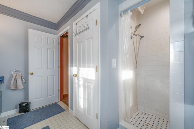 bathroom featuring a textured ceiling, a shower with shower curtain, and crown molding