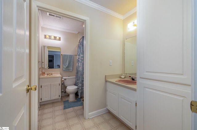 bathroom with vanity, a textured ceiling, and crown molding