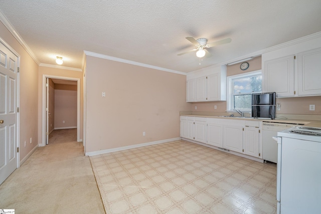 kitchen with white appliances, white cabinetry, ceiling fan, and a textured ceiling