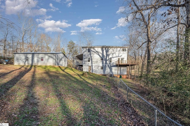 rear view of house with a wooden deck