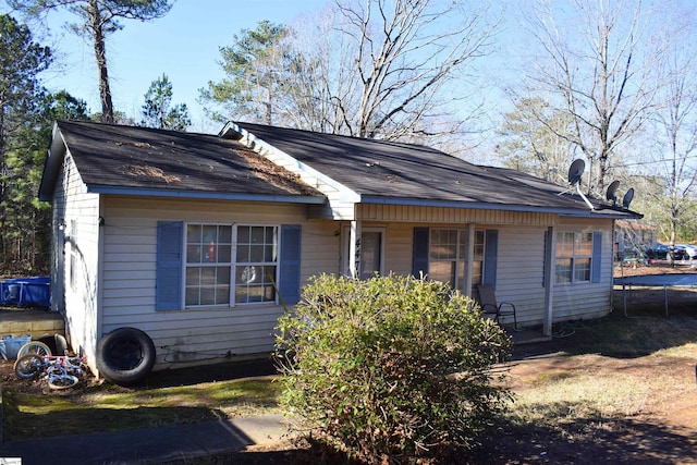 view of home's exterior with a trampoline