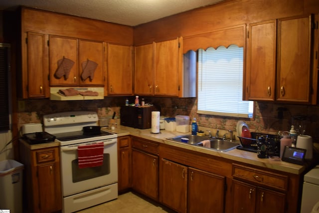 kitchen with sink, a textured ceiling, white electric range oven, decorative backsplash, and ventilation hood