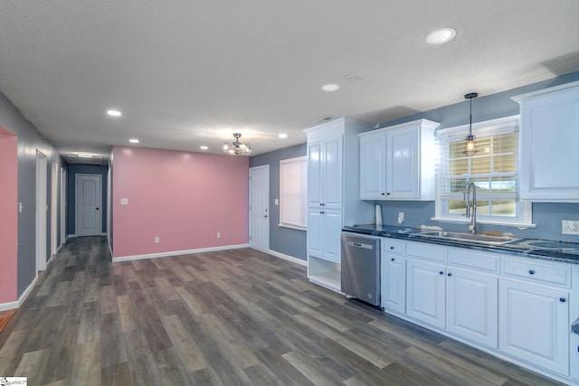 kitchen with stainless steel dishwasher, pendant lighting, dark hardwood / wood-style floors, white cabinetry, and sink