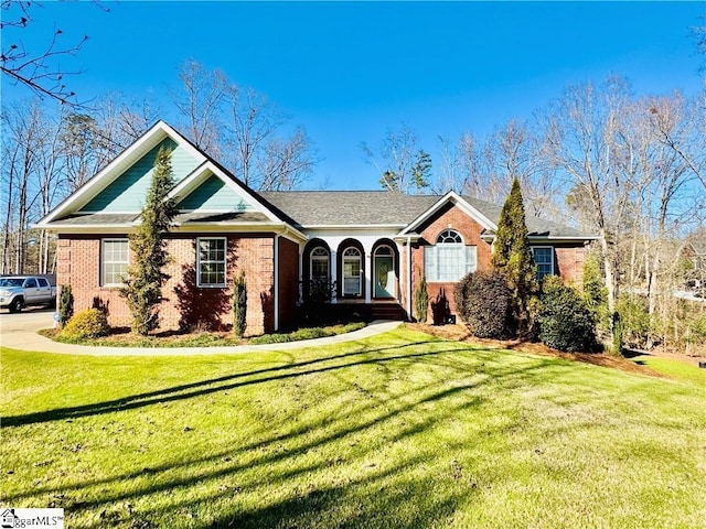 ranch-style home with a front lawn