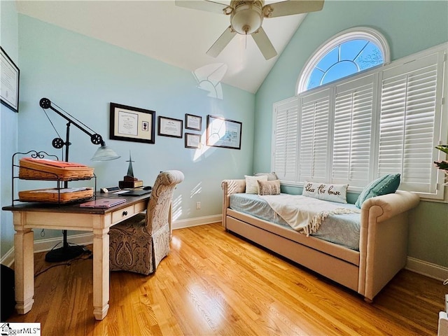 bedroom with vaulted ceiling, ceiling fan, and light hardwood / wood-style flooring