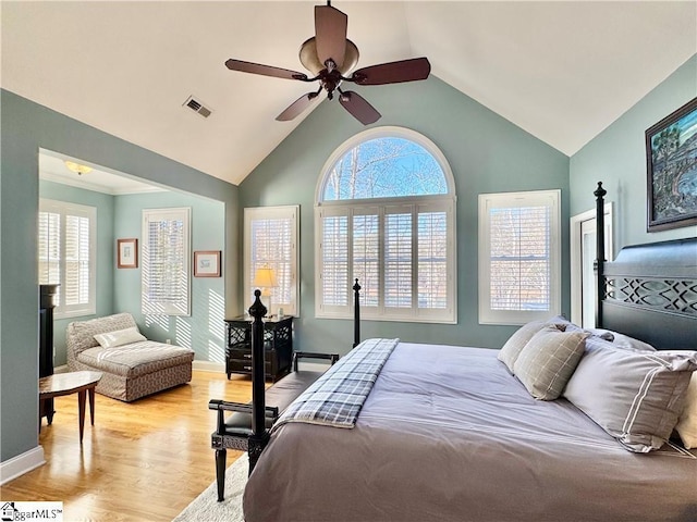 bedroom with vaulted ceiling, ceiling fan, and light hardwood / wood-style floors