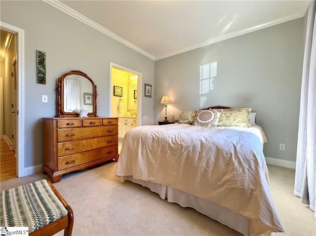 bedroom with ensuite bathroom, ornamental molding, and light colored carpet