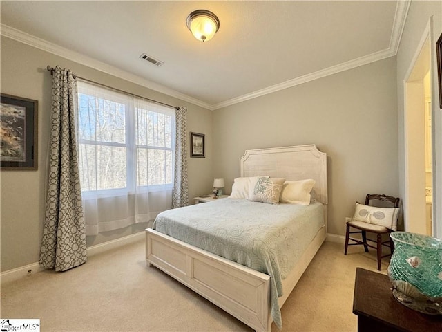 bedroom with ornamental molding and light carpet