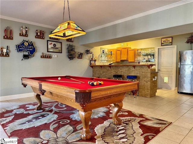 playroom with pool table, indoor bar, ornamental molding, and light tile patterned floors