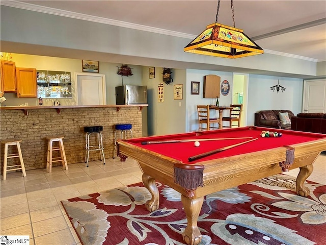 rec room featuring pool table, crown molding, brick wall, and bar