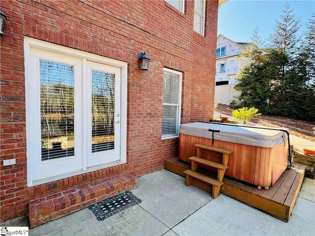 exterior space featuring a hot tub and a patio area