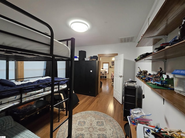 bedroom featuring hardwood / wood-style floors