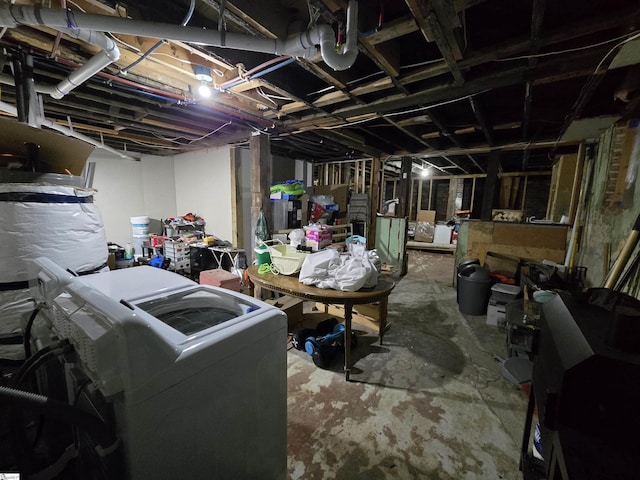 basement with washing machine and clothes dryer