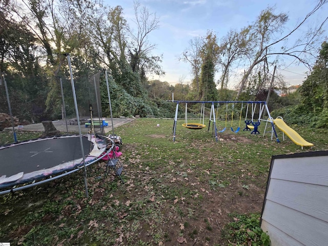 view of play area featuring a yard and a trampoline