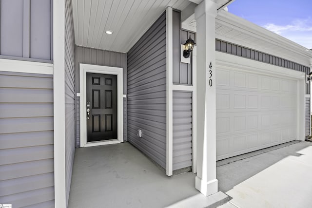 view of exterior entry featuring a garage