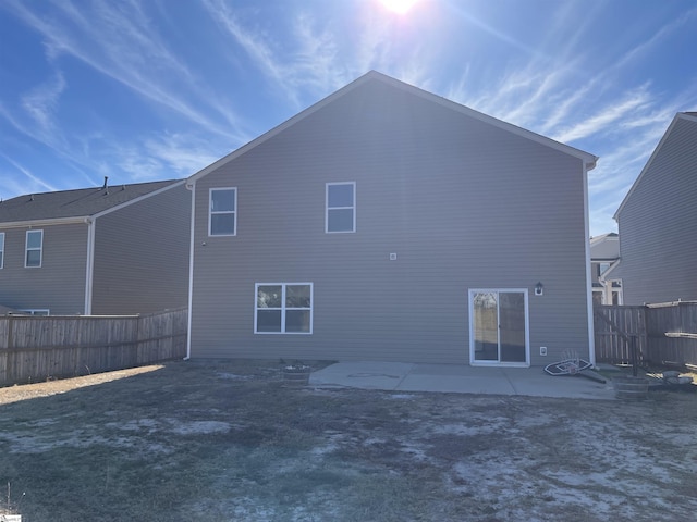 back of property featuring a patio