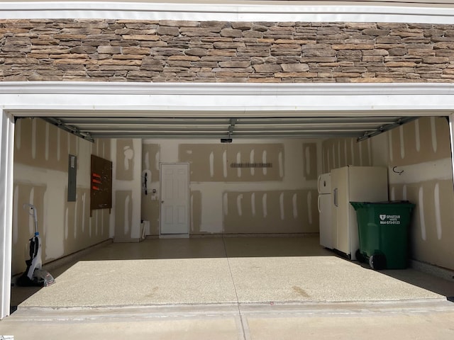 garage with white refrigerator