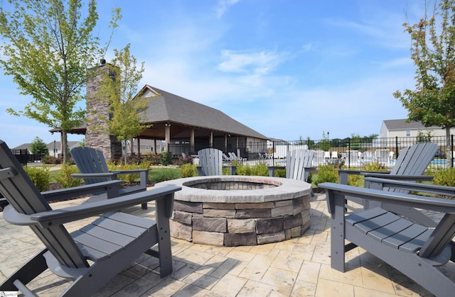 view of patio / terrace with an outdoor fire pit