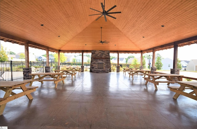 sunroom / solarium featuring ceiling fan, wood ceiling, and lofted ceiling