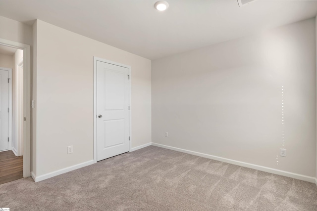 unfurnished bedroom featuring carpet