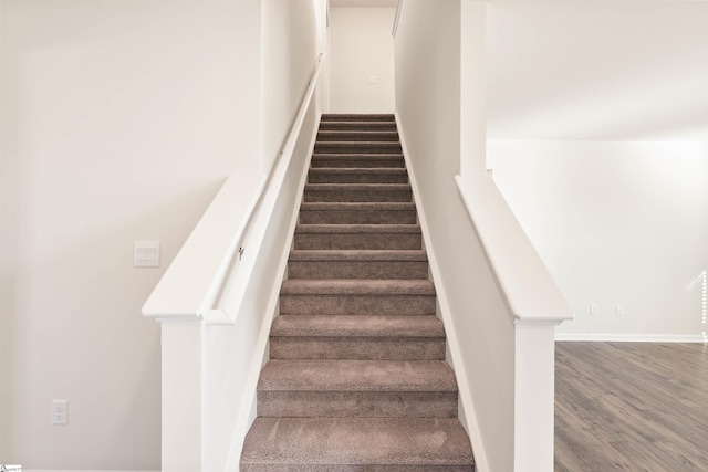 staircase featuring hardwood / wood-style floors