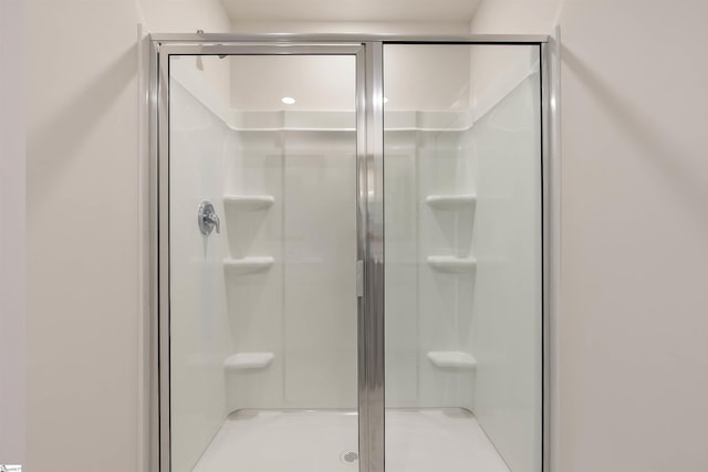 bathroom featuring an enclosed shower