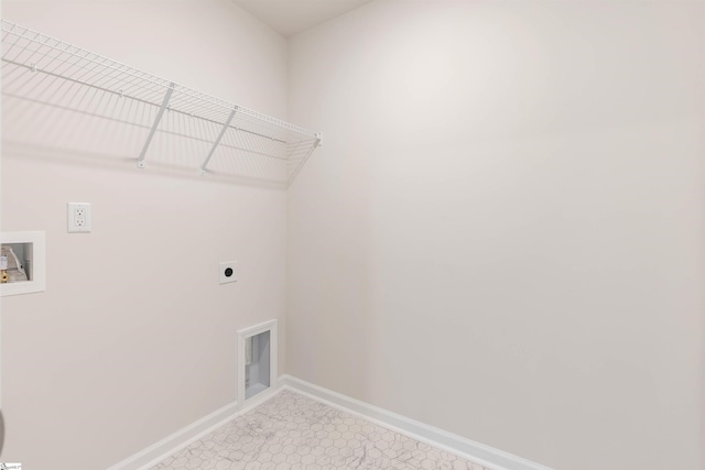 laundry room featuring electric dryer hookup, hookup for a washing machine, and tile patterned floors