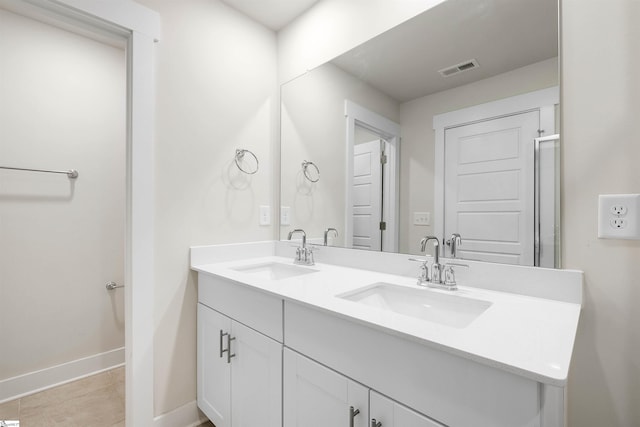 bathroom with vanity and tile patterned flooring