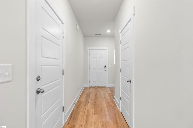 corridor featuring light hardwood / wood-style floors