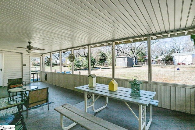 sunroom featuring ceiling fan and a healthy amount of sunlight